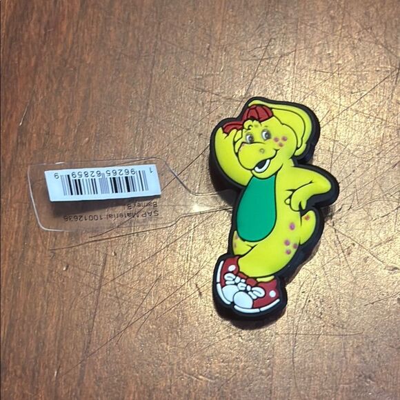NWT Crocs Jibbitz Barney BJ Yellow Cartoon Dinosaur Shoe Charm - Picture 1 of 3